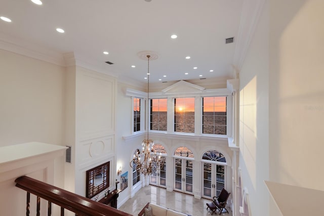 309 Ringling Point Dr, Sarasota, FL 34234 - living area with recessed lighting, crown molding, a chandelier, and a towering ceiling