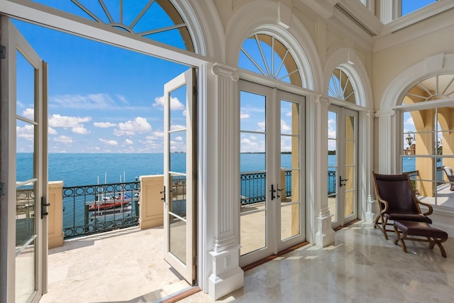 doorway featuring a water view and french doors