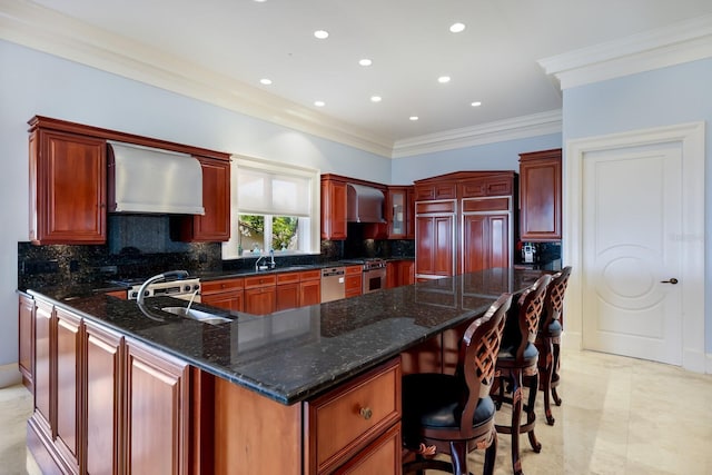 kitchen with ornamental molding, tasteful backsplash, wall chimney exhaust hood, and dark stone countertops