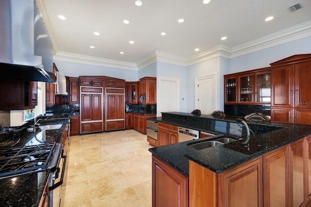 kitchen featuring decorative backsplash, extractor fan, a spacious island, and crown molding