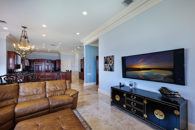 living room with a notable chandelier and ornamental molding