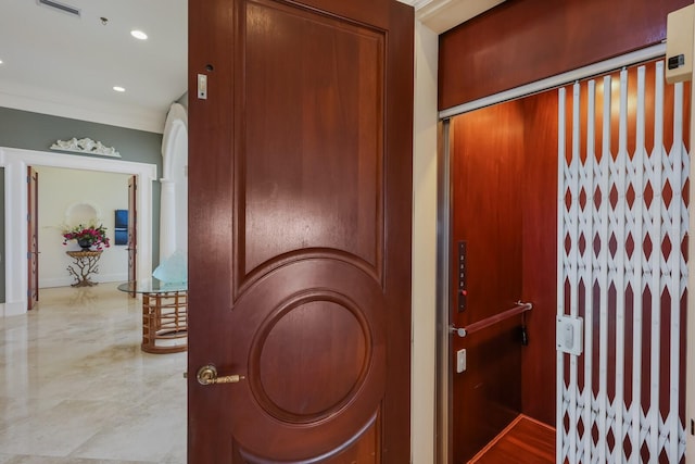 interior space featuring crown molding