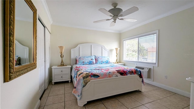 tiled bedroom with a wall mounted air conditioner, ceiling fan, crown molding, and a closet