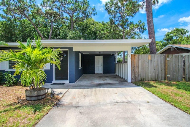 exterior space featuring a carport