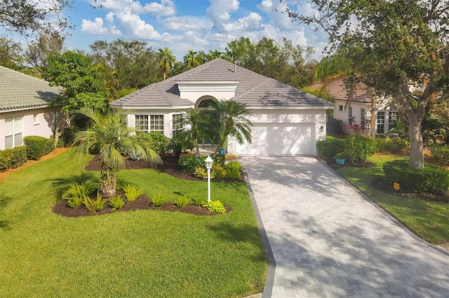 view of front of house featuring a front yard and a garage