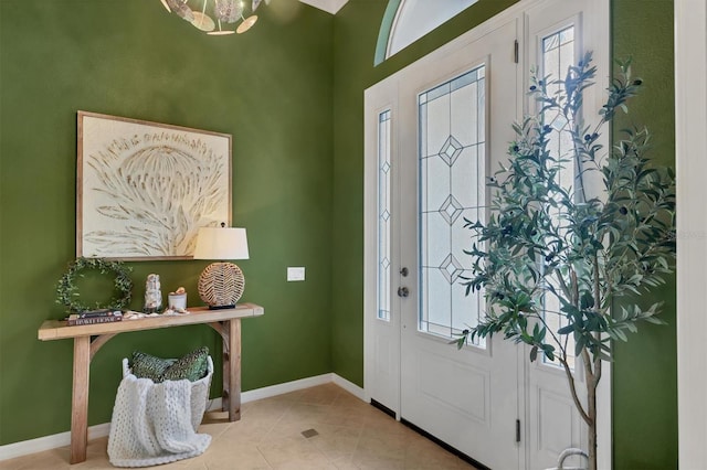 entrance foyer featuring plenty of natural light and light tile patterned floors