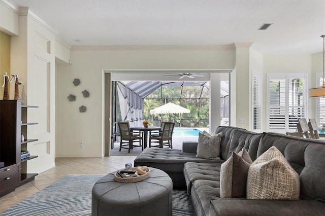 tiled living room with ornamental molding and a wealth of natural light