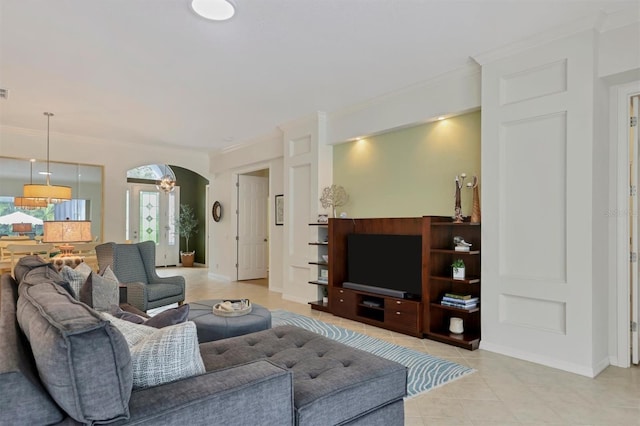 living room with french doors, light tile patterned floors, and crown molding