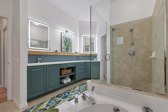 bathroom with plus walk in shower, vanity, and tile patterned floors