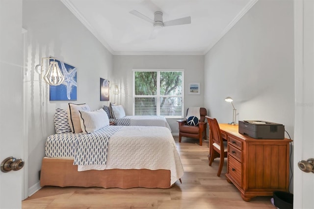 bedroom with light hardwood / wood-style floors, ceiling fan, and crown molding