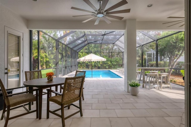 view of swimming pool featuring a patio and a lanai