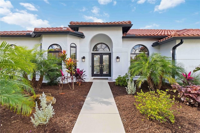 doorway to property featuring french doors