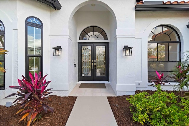 doorway to property featuring french doors