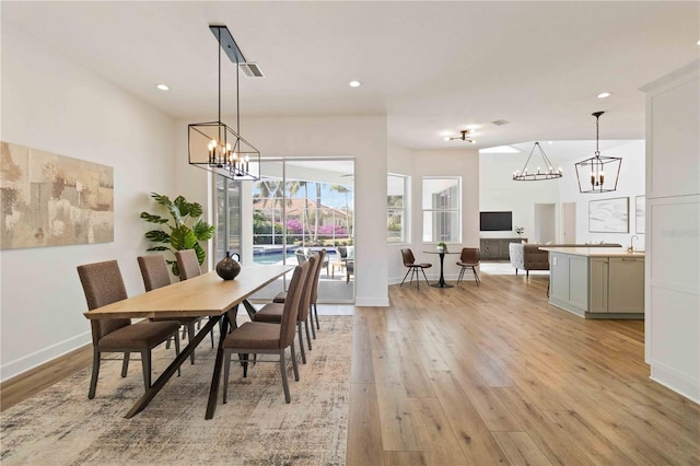 dining area featuring light wood-type flooring