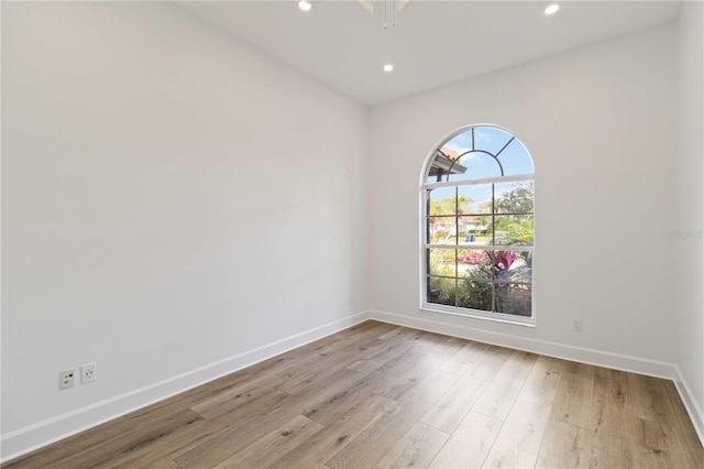 spare room featuring light hardwood / wood-style flooring