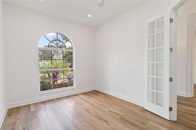 unfurnished room with light wood-type flooring