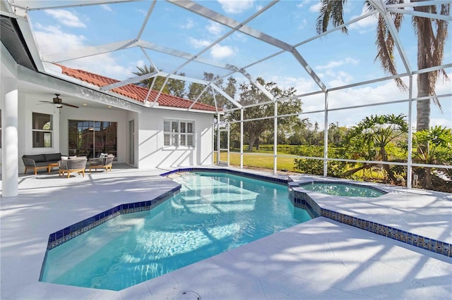 view of pool featuring an outdoor hangout area, ceiling fan, a lanai, an in ground hot tub, and a patio