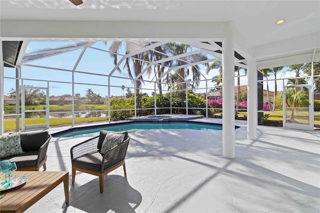 view of pool with a lanai, an in ground hot tub, a water view, and a patio