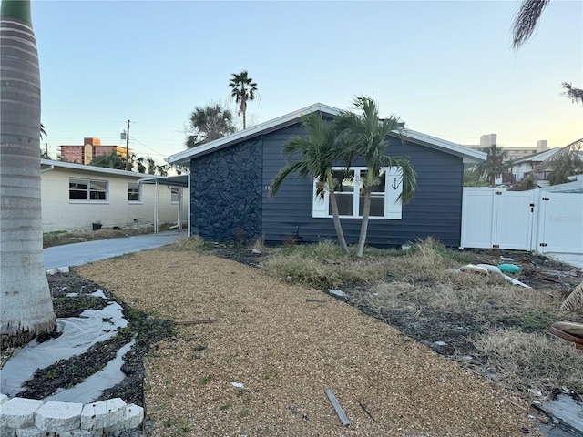 exterior space with a carport