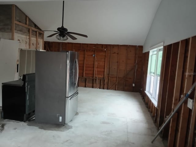 kitchen with stainless steel refrigerator, ceiling fan, and vaulted ceiling