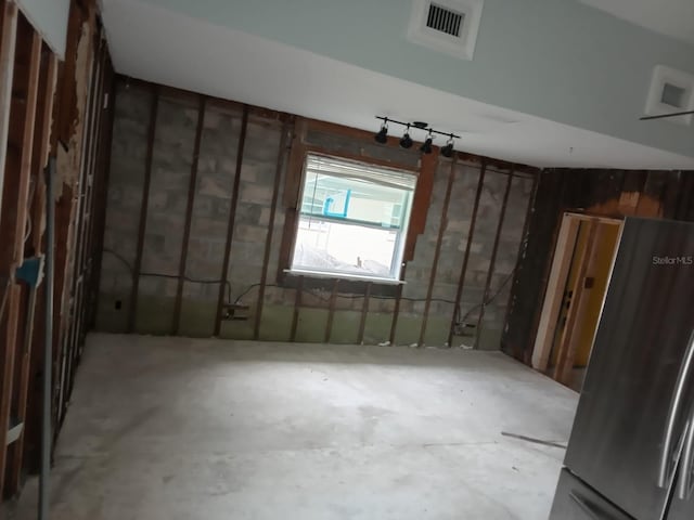 interior space featuring stainless steel fridge