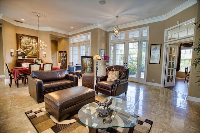 living room featuring a chandelier, crown molding, and french doors