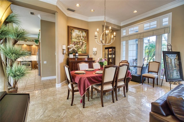 dining space featuring ornamental molding and a chandelier