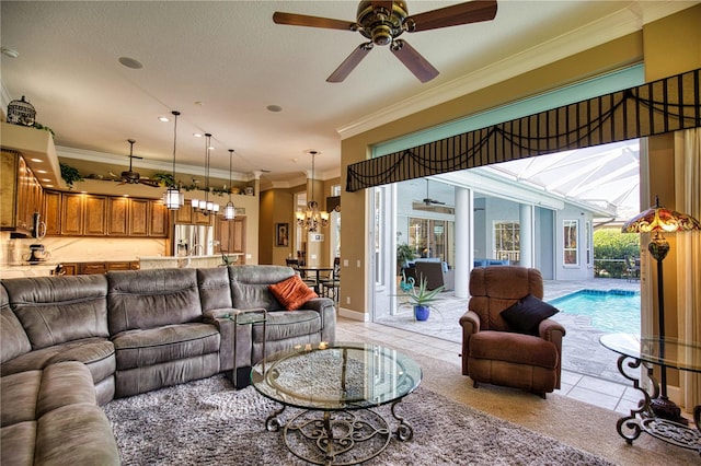 living room featuring a textured ceiling, ceiling fan with notable chandelier, light tile patterned floors, and crown molding