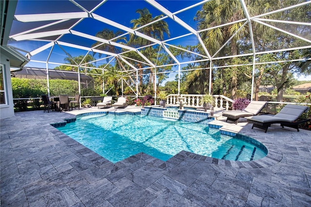 view of swimming pool featuring a patio and a lanai