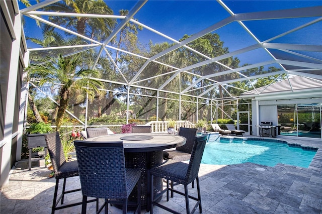 view of pool featuring a patio, grilling area, and a lanai