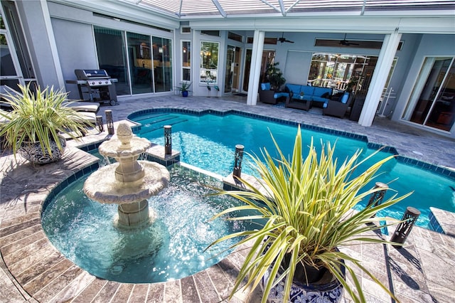 view of swimming pool with outdoor lounge area, ceiling fan, a patio area, and grilling area