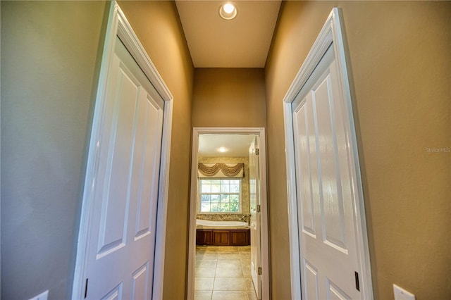 hallway featuring light tile patterned floors