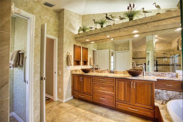 bathroom with vanity and independent shower and bath