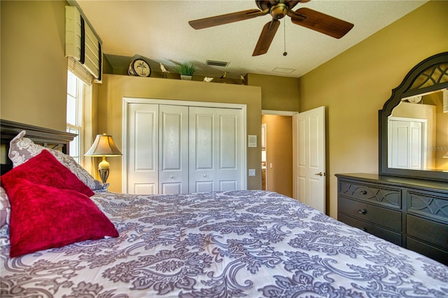 bedroom featuring a textured ceiling, a closet, and ceiling fan