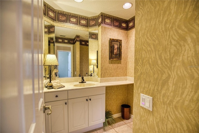 bathroom with tile patterned flooring and vanity