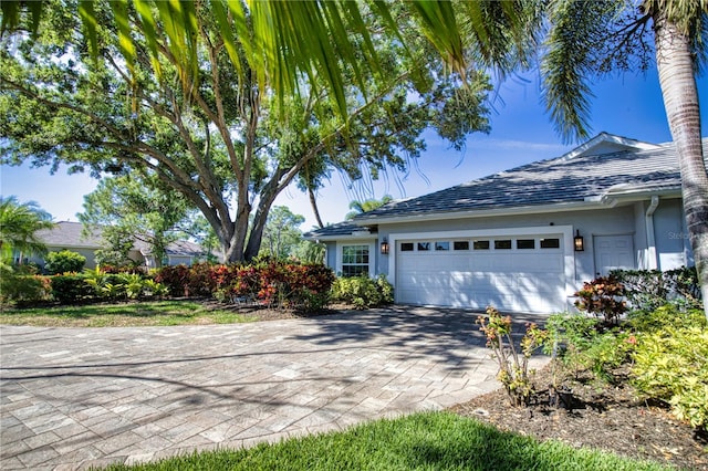 view of side of home featuring a garage