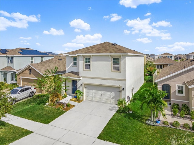 view of front property with a garage and a front yard