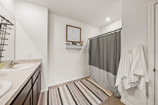 bathroom with vanity and a shower with shower curtain