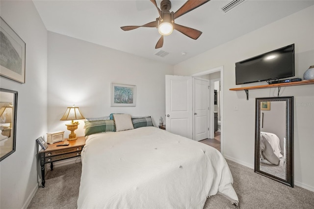 bedroom with ceiling fan and light colored carpet