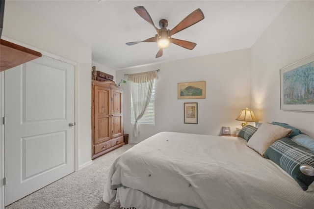 bedroom with ceiling fan and light colored carpet