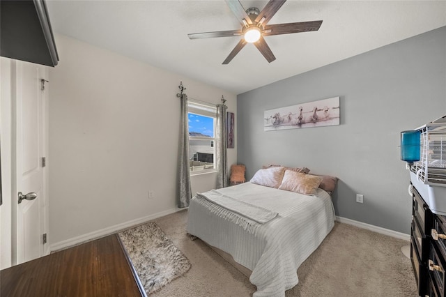 bedroom with light colored carpet and ceiling fan