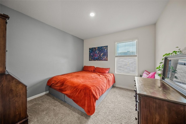 bedroom featuring light colored carpet