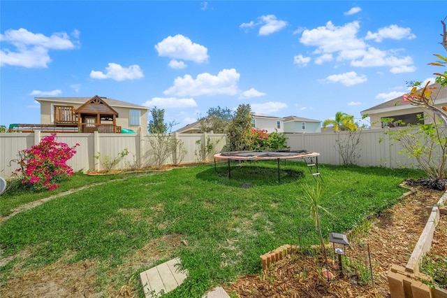 view of yard featuring a trampoline