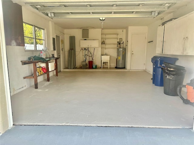 garage featuring water heater and sink