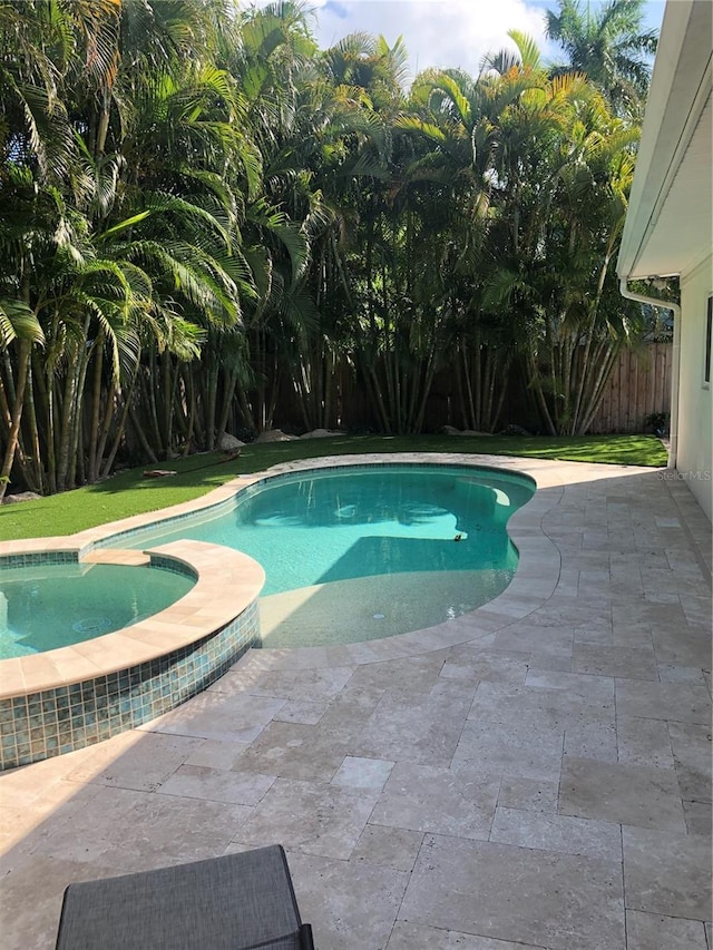 view of pool featuring a patio area