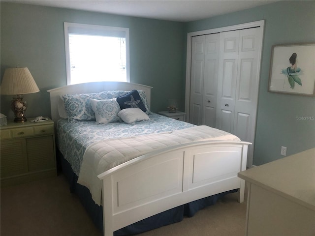 carpeted bedroom with a closet