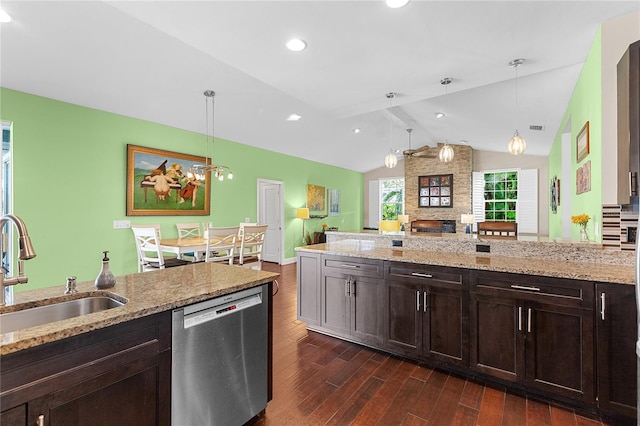 kitchen with light stone countertops, dishwasher, sink, hanging light fixtures, and lofted ceiling with beams