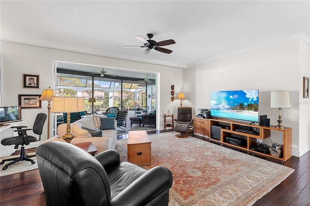 living room featuring ceiling fan, ornamental molding, and dark wood-type flooring