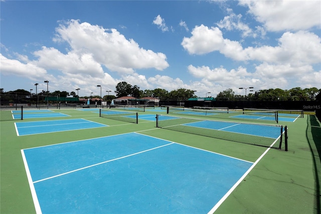 view of tennis court featuring basketball court