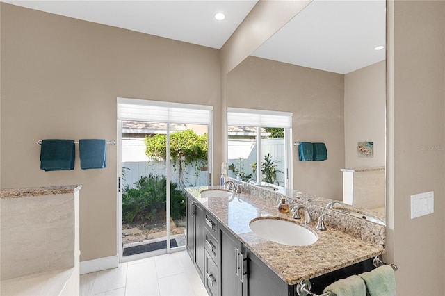 bathroom with tile patterned floors and vanity